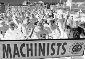 Boeing machinists march from company's Renton, Washington factory to their union hall to vote on the company's final contract offer